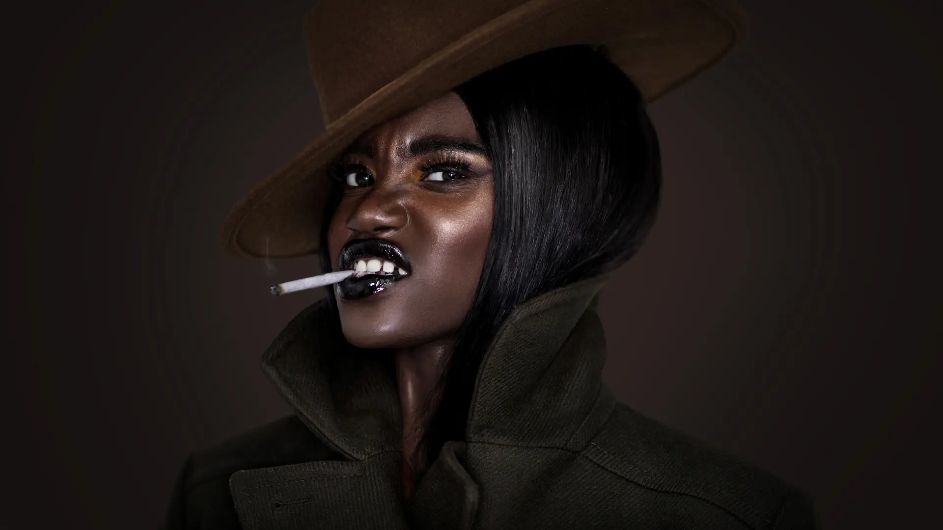 Clean & Serene: How Beauty Editorial Creative Direction Turned a Mood Board into a Published Story - Phil Halfmann Beauty editorial photography finale with long black hair, black lipstick, brown hat and structured dark coat