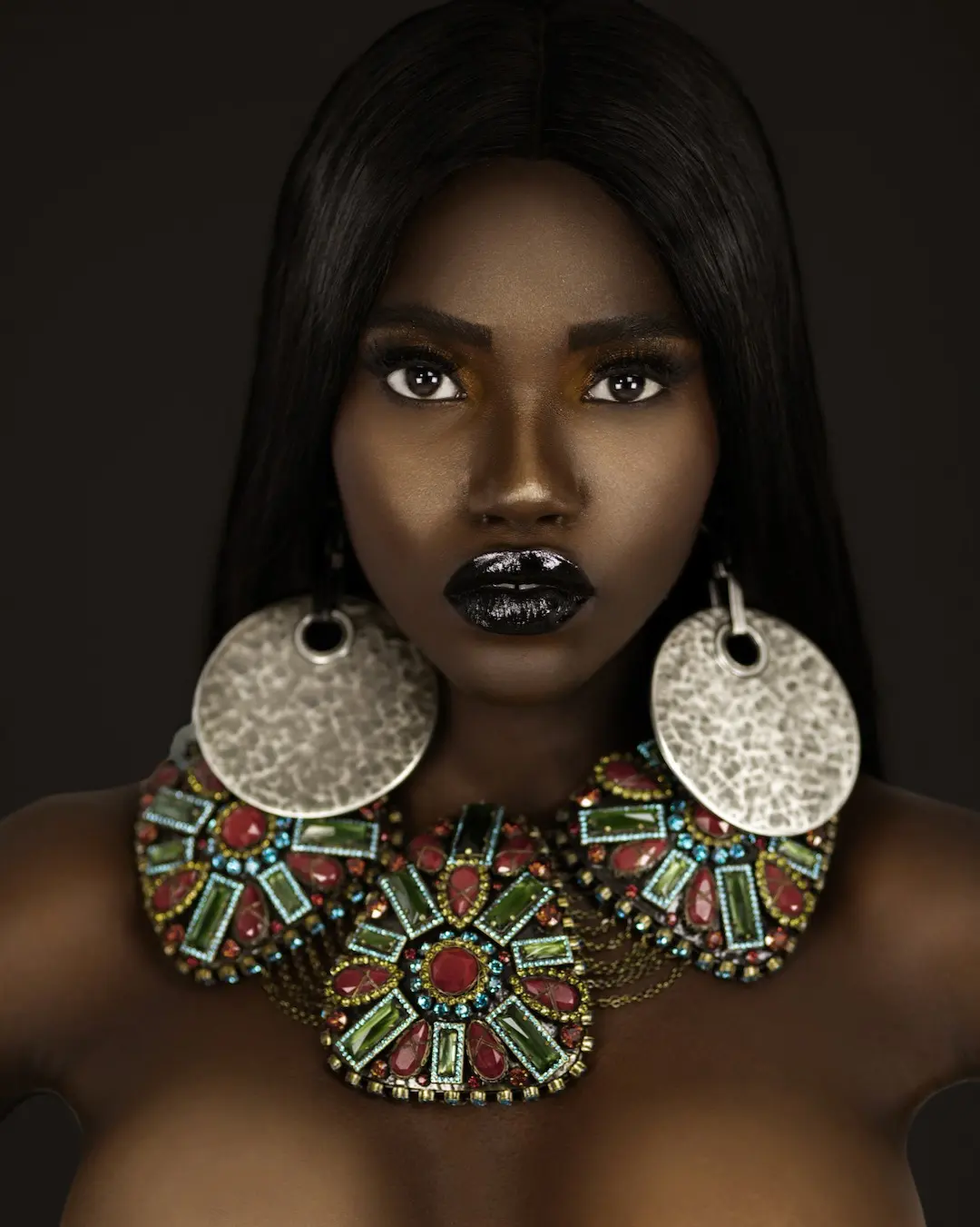 Beauty portrait with black lipstick and oversized KONPLOTT statement jewelry