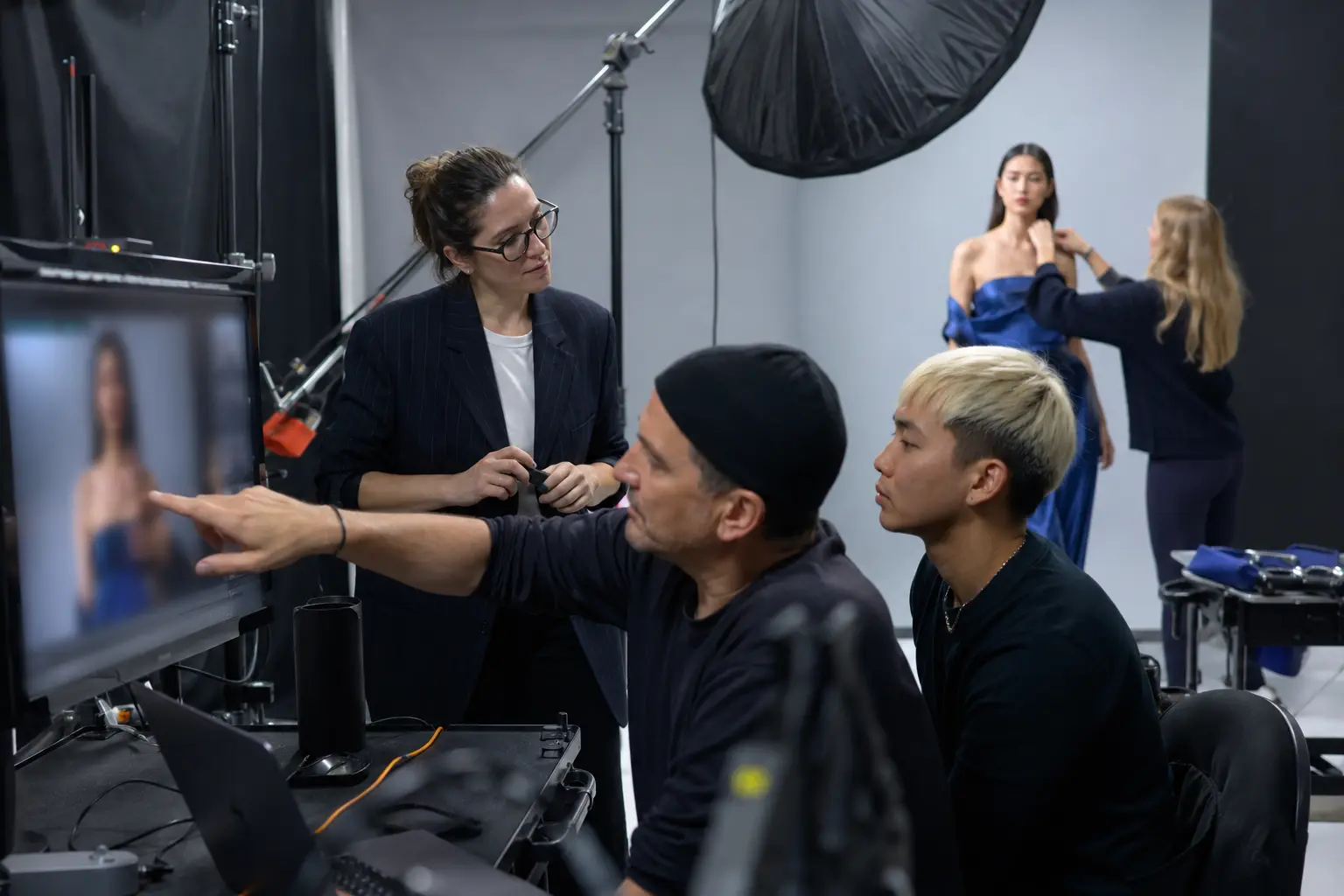 Fashion Campaign Production Roles Explained: Who Does What on Set? - Phil Halfmann Photographer and digital technician reviewing an image during a fashion campaign shoot