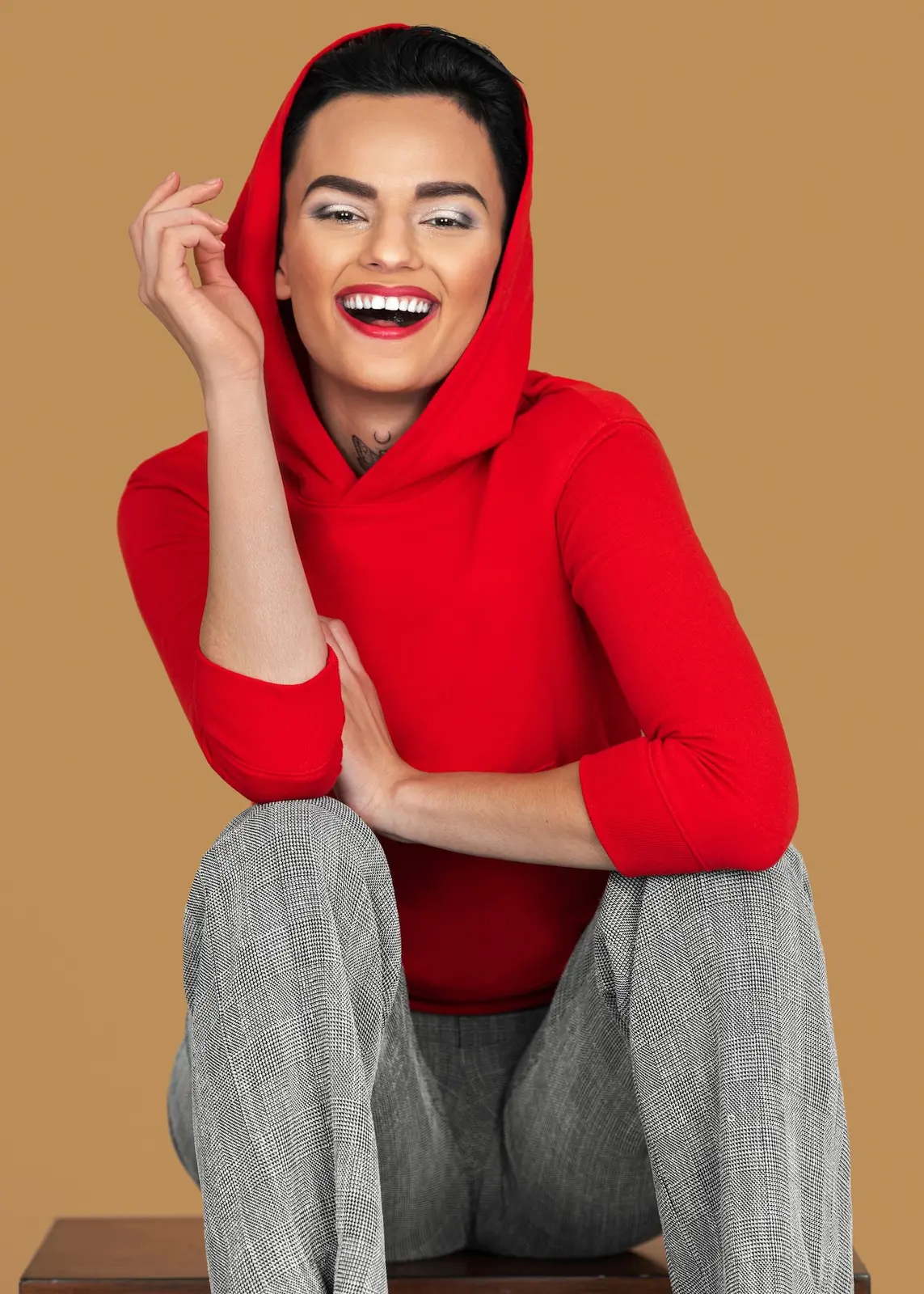 Zalando Beauty: Turning an Inclusive Creative Vision into a Scalable Photoshoot - Phil Halfmann Skye smiling in a red hoodie during the inclusive Zalando Beauty campaign