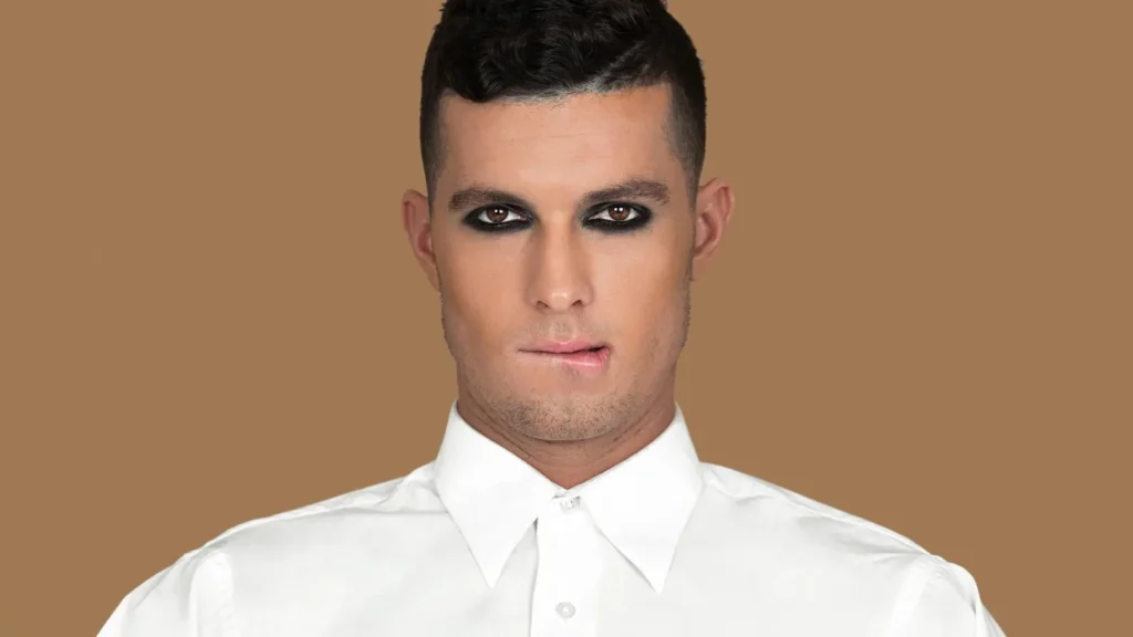 Zalando Beauty: Turning an Inclusive Creative Vision into a Scalable Photoshoot - Phil Halfmann Ryan photographed in a white shirt with bold black eye makeup for Zalando Beauty