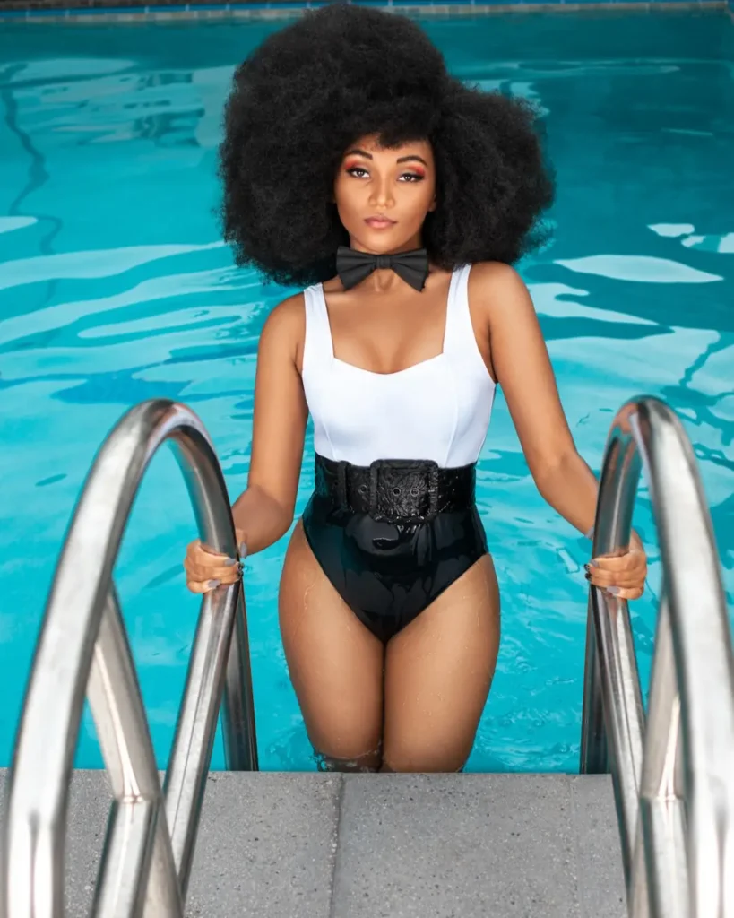 Jordan Kristine Seamon in a monochrome swimsuit look created through the fashion magazine content retainer