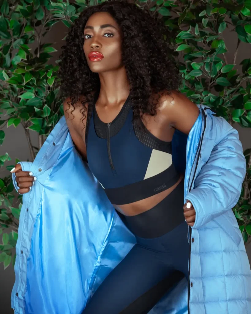 CASALL activewear with a blue coat and foliage in the Spring Is in the Air fashion editorial