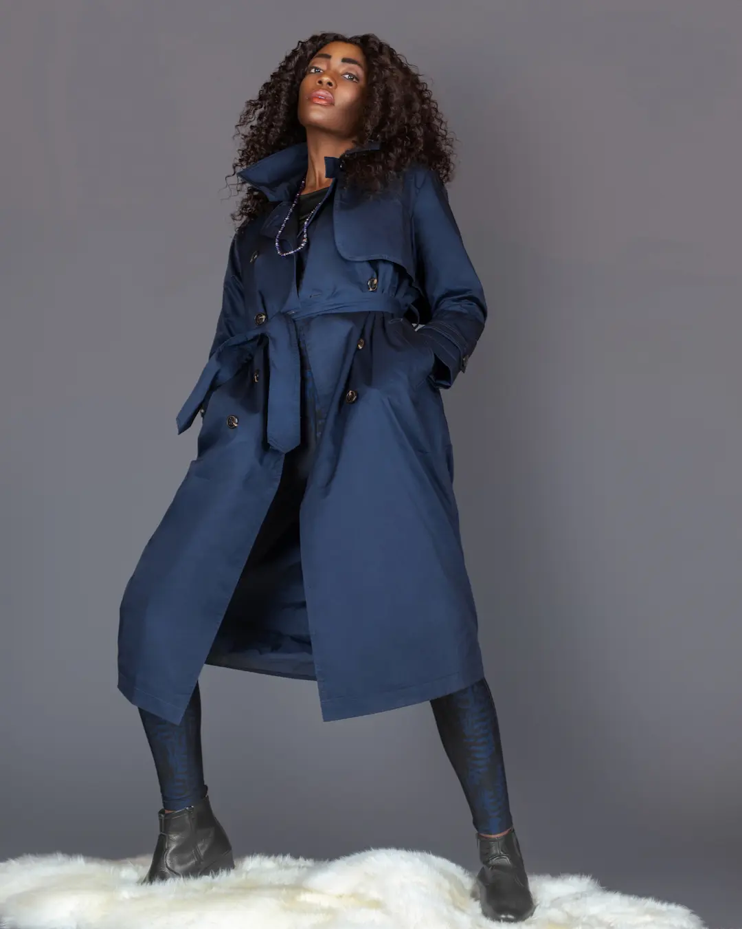 Low-angle portrait with Esprit coat and CASALL leggings in the Spring Is in the Air fashion editorial