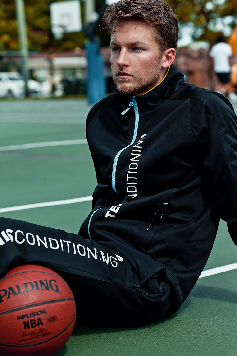 Consistency Over Virality: 5 Steps to Brand Growth - Phil Halfmann Male model wearing branded StyleConditioning activewear in an outdoor basketball campaign