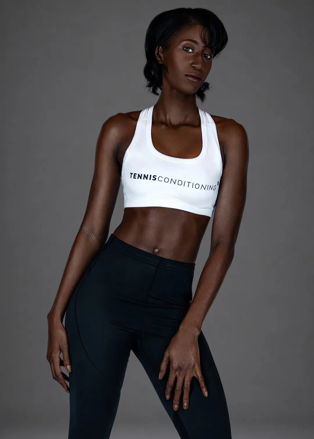 Consistency Over Virality: 5 Steps to Brand Growth - Phil Halfmann Female model wearing a white StyleConditioning sports bra in a studio campaign portrait