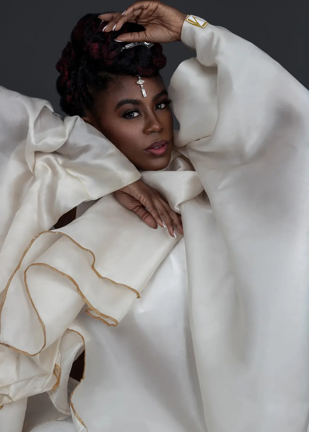 Fabric-framed beauty portrait created as a close supporting asset for Tanya Marie’s content infrastructure