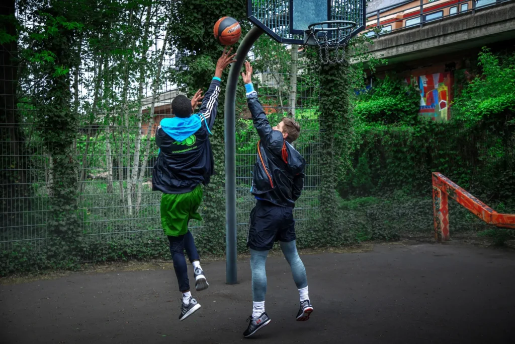 Berlin in Motion: A Sports Campaign Built Across Stills and Film - Phil Halfmann Basketball players contesting a shot on an urban court in Berlin
