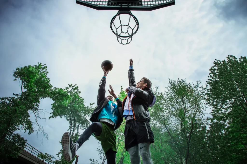 Berlin in Motion: A Sports Campaign Built Across Stills and Film - Phil Halfmann Low-angle basketball action beneath an outdoor hoop in Berlin
