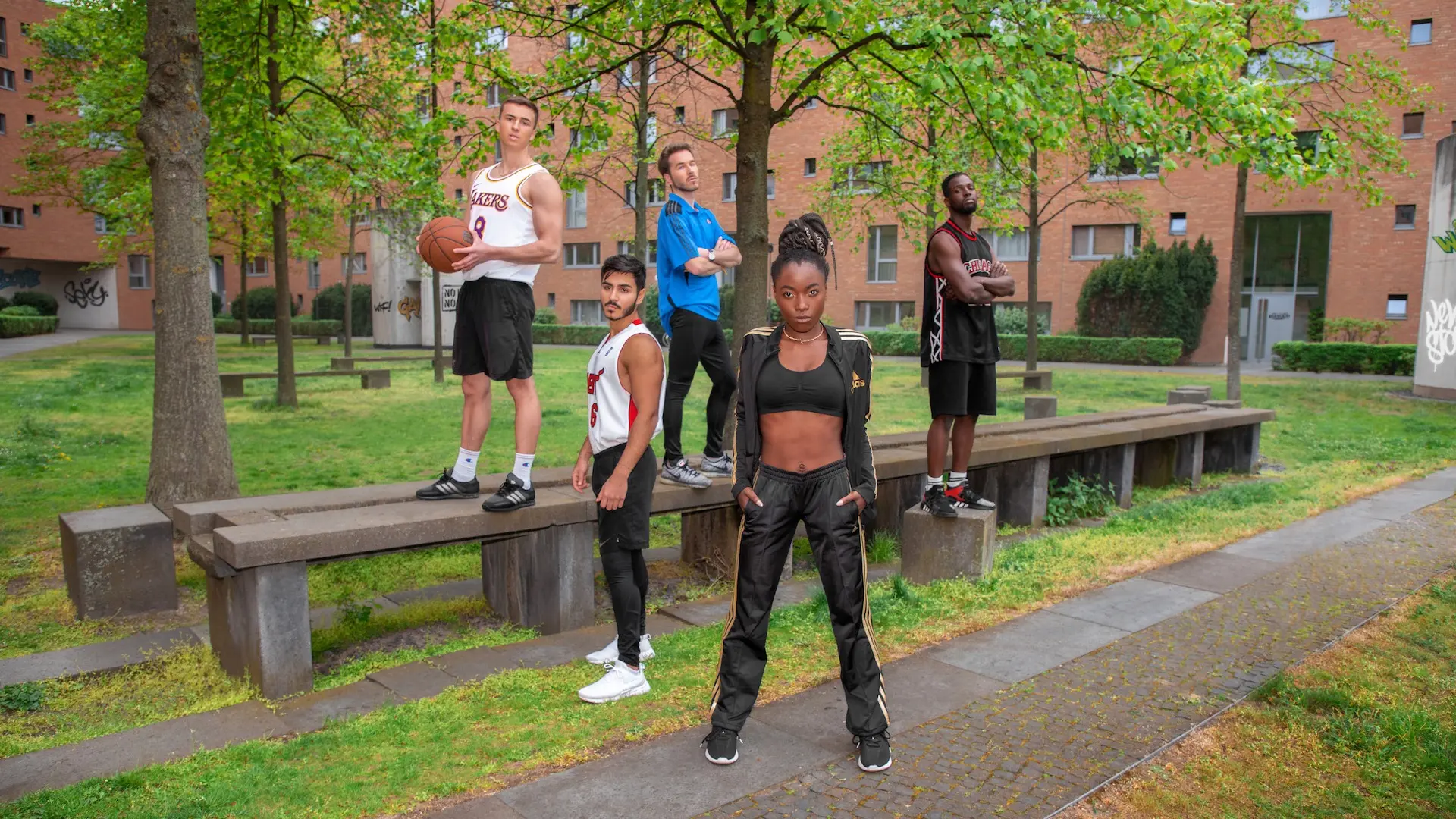 Sports cast assembled in an outdoor Berlin workout park