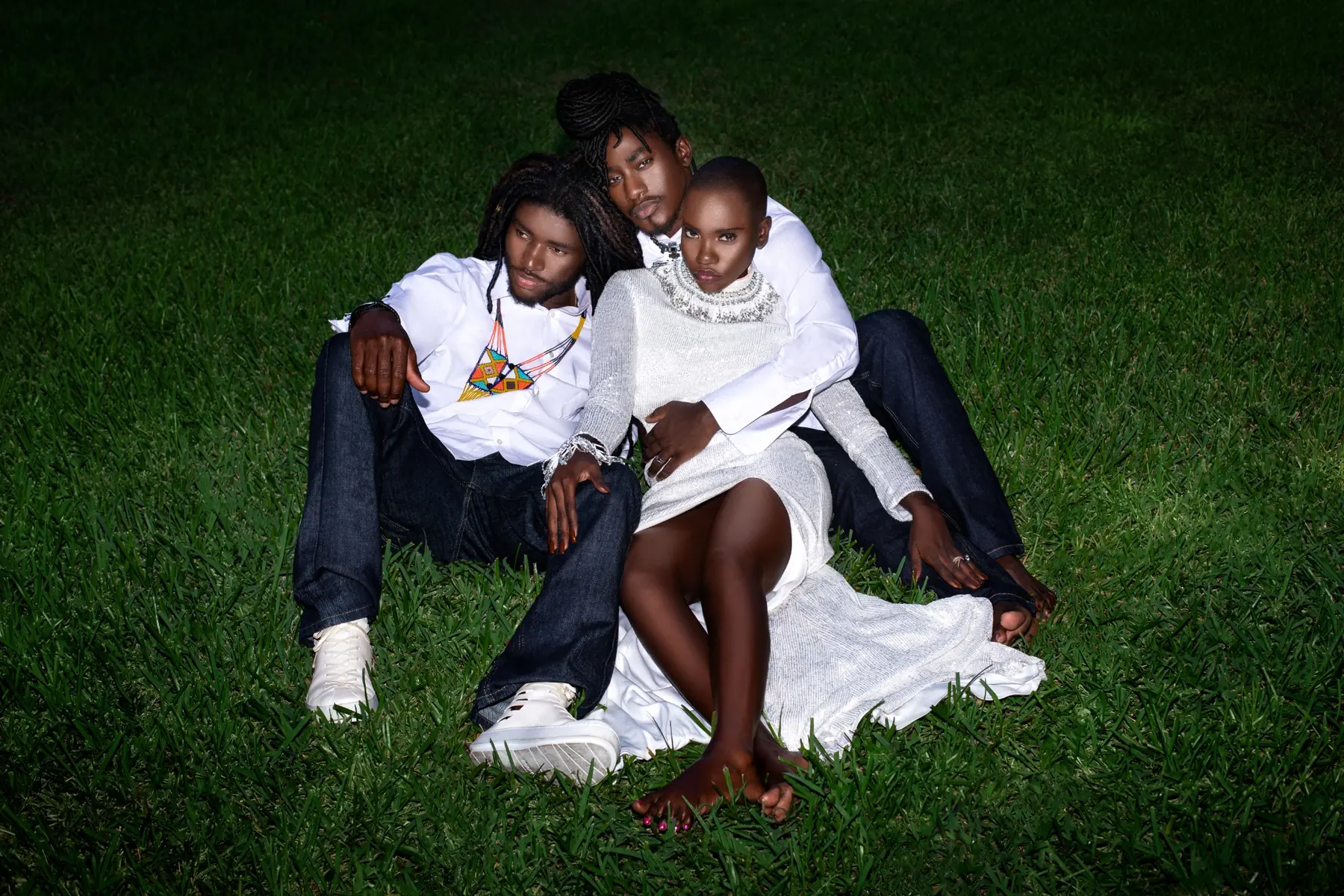 Gaelle and Djanto seated in a coordinated fashion editorial variation