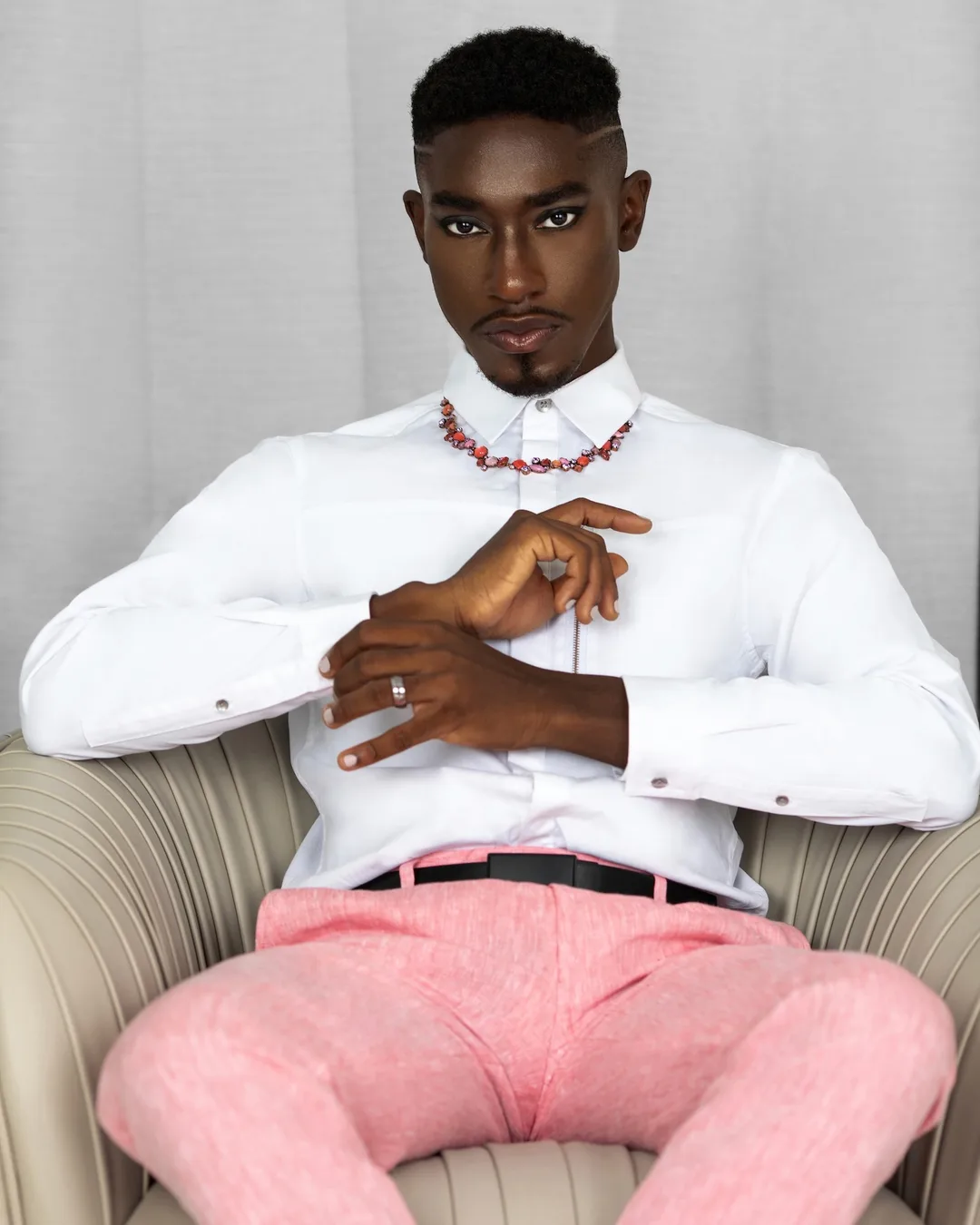 How Many Images Does a Fashion Brand Need? A Planning Model - Phil Halfmann Medium portrait of Troy in pink trousers with jewelry and painted nails