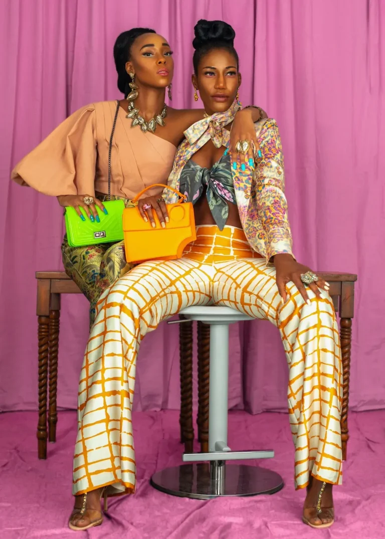Two models in patterned fashion looks illustrating coordinated campaign assets for launch deployment