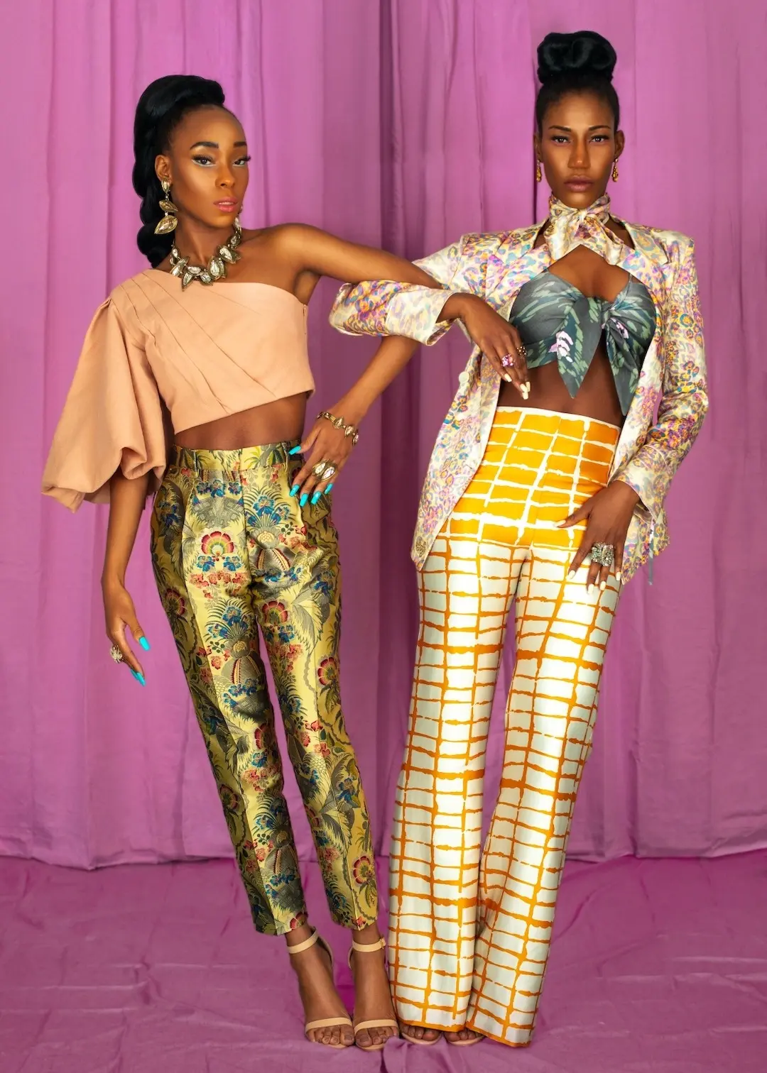 Standing fashion duo demonstrating a full-length vertical editorial asset