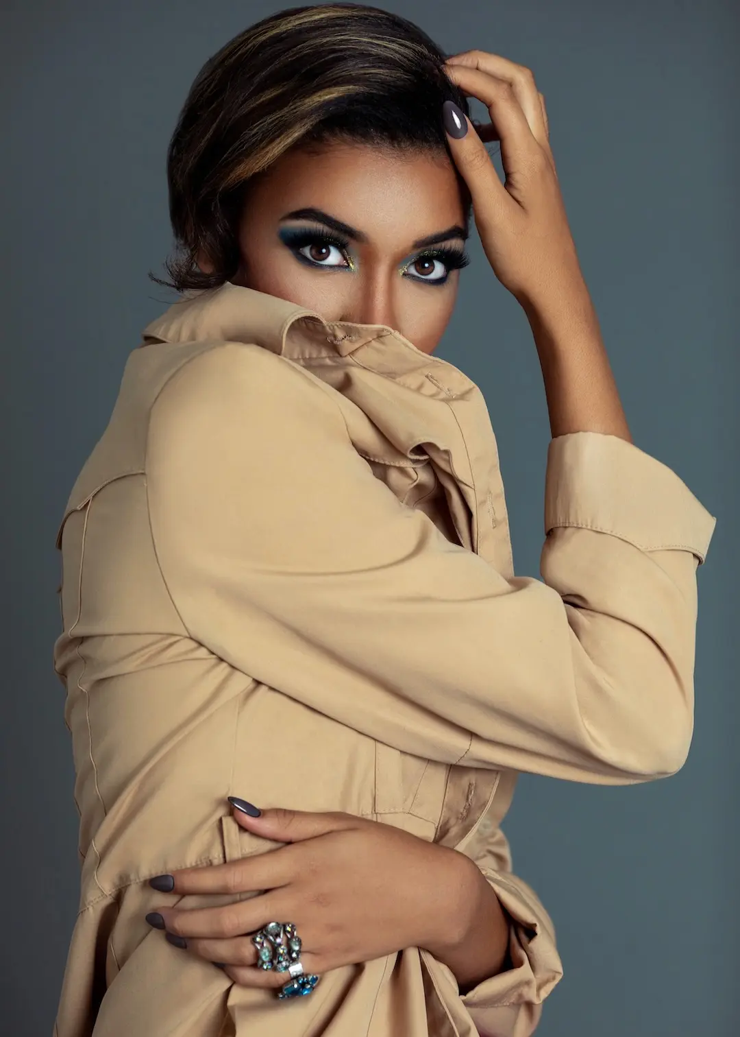 Fianna wearing a neutral coat in the Bold, Savage & Materialistic evergreen beauty content case study.