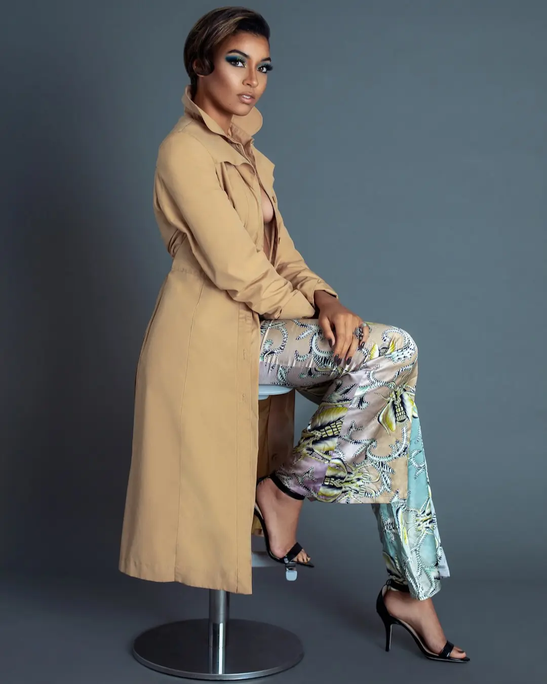 What to Expect From a Fashion Campaign Photographer - Phil Halfmann Fianna wearing a neutral coat and patterned trousers in a full studio fashion portrait