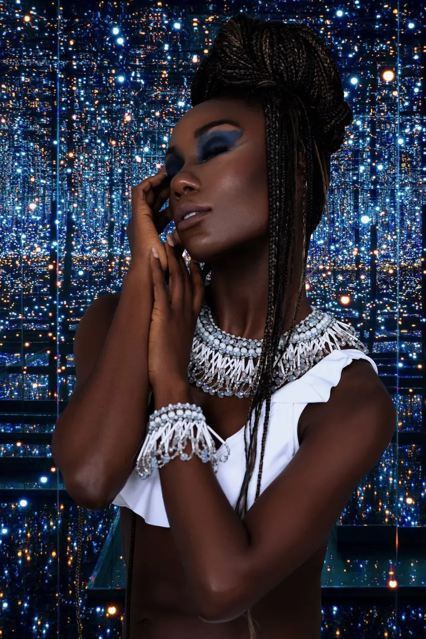 Blue eye makeup and silver jewelry close-up from the Colour Me Beautiful editorial
