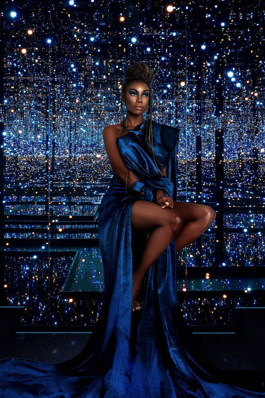 Seated portrait in a cobalt blue dress from the Colour Me Beautiful beauty editorial