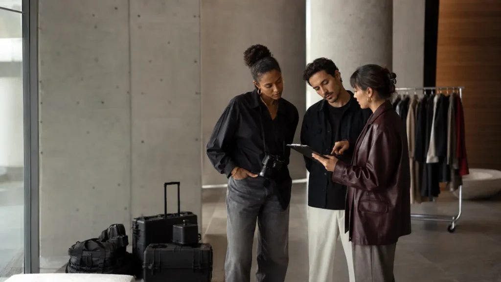 Fashion production team reviewing a fashion campaign location release before a commercial shoot