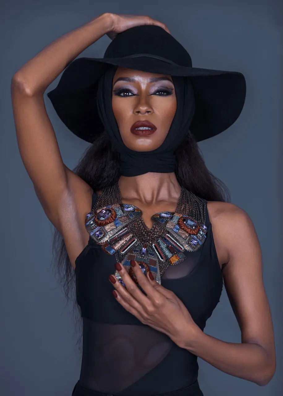 Studio Fashion Editorial Production: Simple Comforts - Phil Halfmann Jovona Logan in a wide black hat and embellished black neckline for the Simple Comforts editorial.
