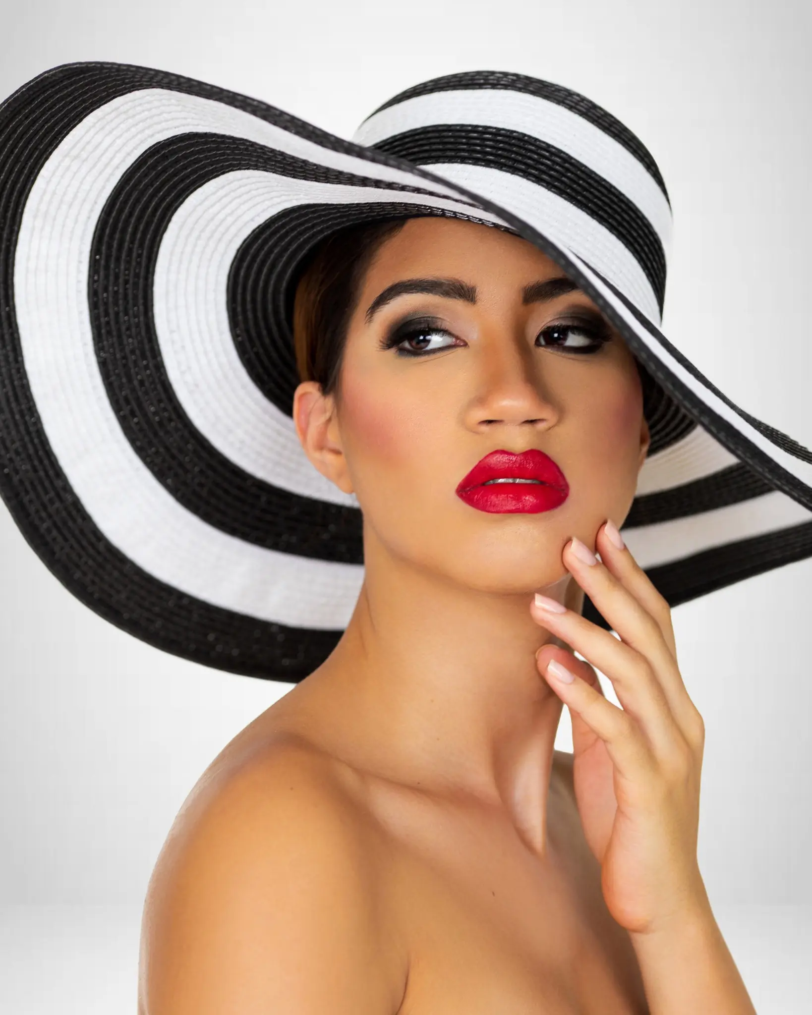Campaign Photography Usage Rights: What Brands Need Before a Shoot - Phil Halfmann Fashion beauty portrait with a black-and-white striped hat and red lipstick photographed by Phil Halfmann